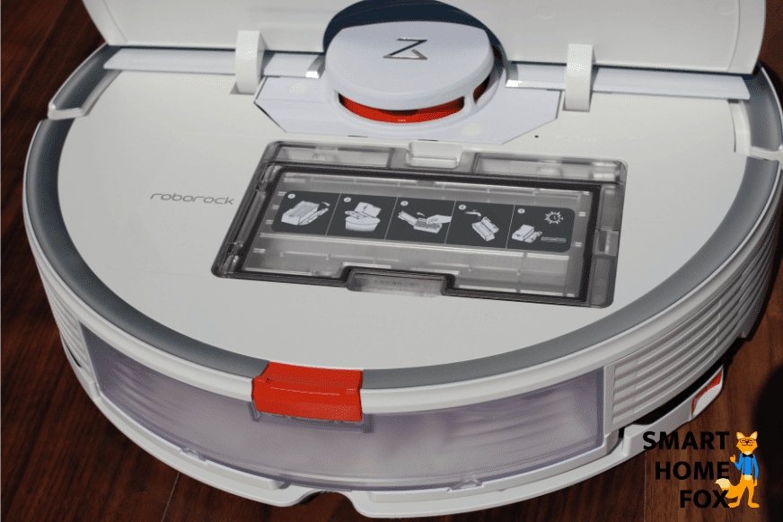 Roborock stands with an open lid on the floor